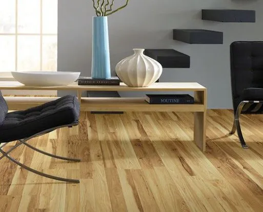 Wide plank vinyl flooring in a traditional dining room