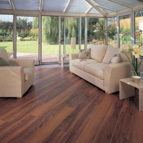 Sunroom with light faux wood flooring